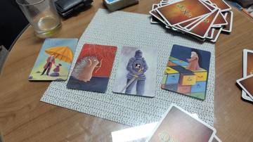 A picture of cards from a hint-giving game with the hint "Ursus"