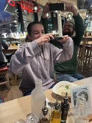 A picture of Ursus taking a picture of Hannah taking a picture of Vapiano food