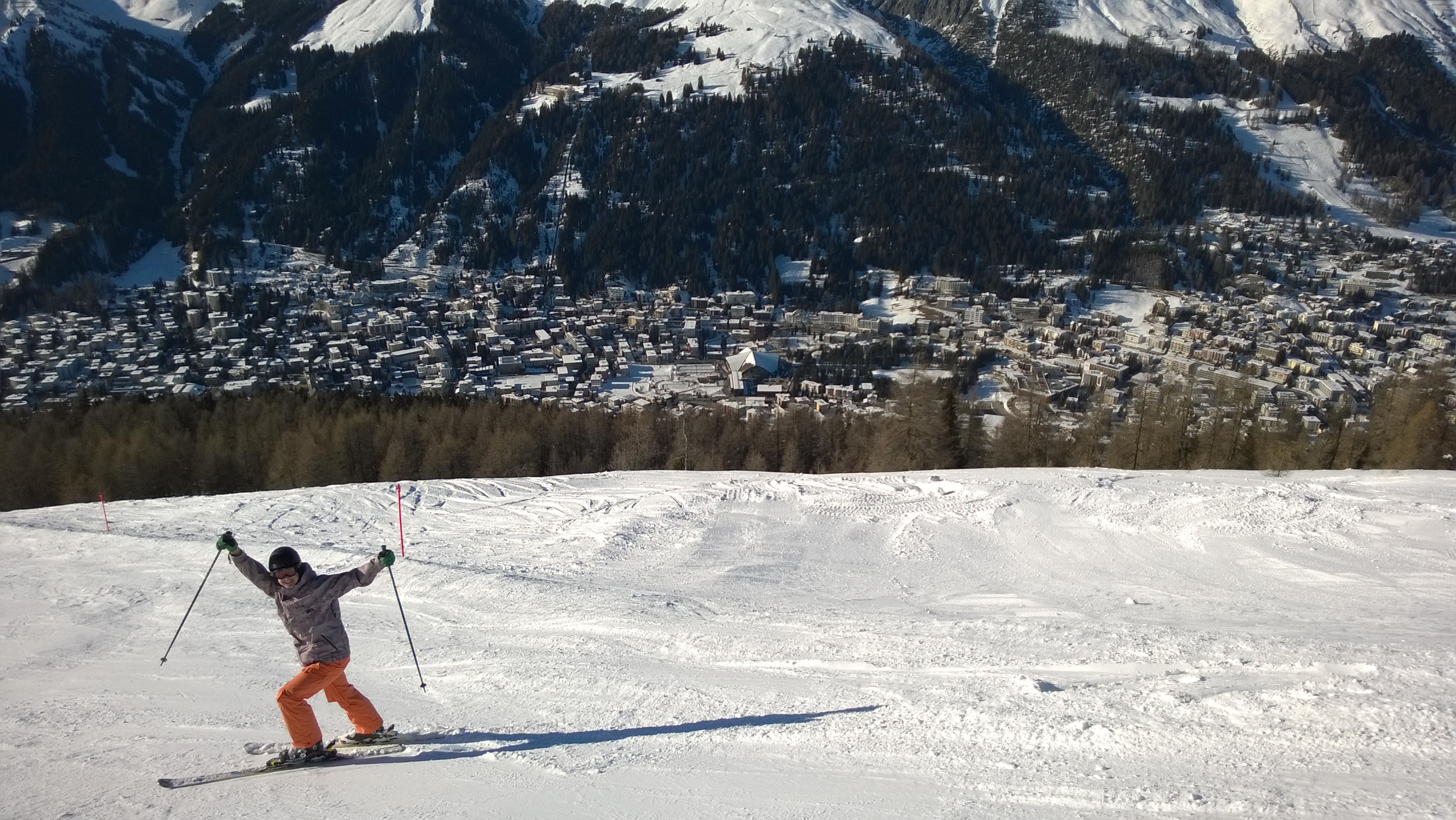 Joel skiing with Davos in the background